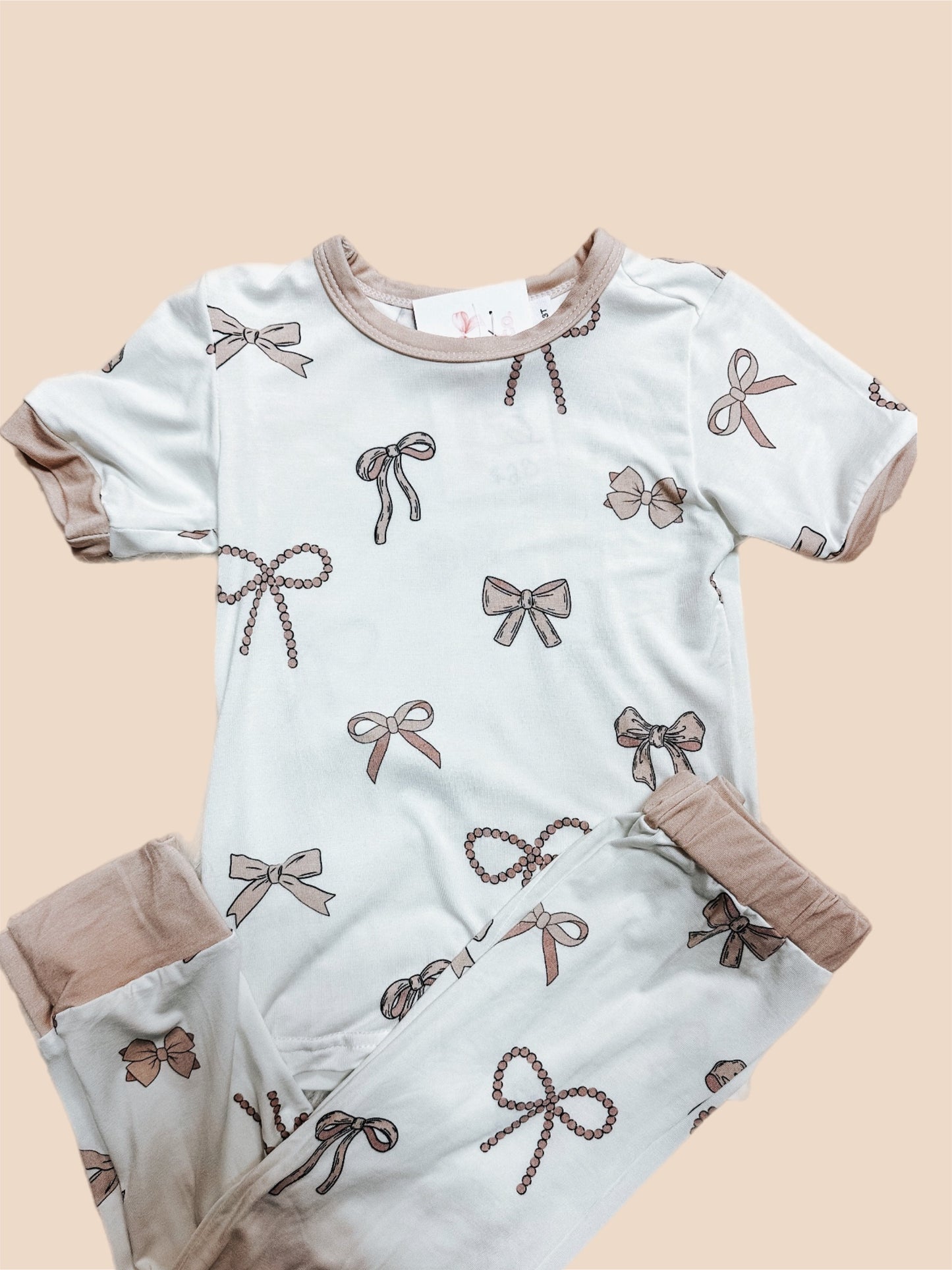 beige bow girl 2 piece bamboo jammie’s ⚡︎